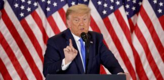 New York is preparing for Trump’s surrender with barricades, closing courtrooms.