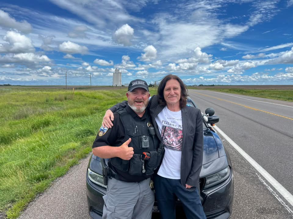 John Waite poses with Kansas deputy during traffic stop