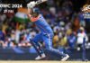 India Storms to History With Third T20 World Cup Title Indian cricketer raises his bat during a celebratory moment after India won its third T20 World Cup title.