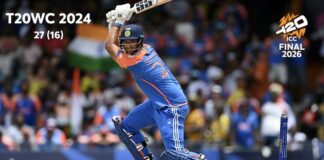 Indian cricketer raises his bat during a celebratory moment after India won its third T20 World Cup title.