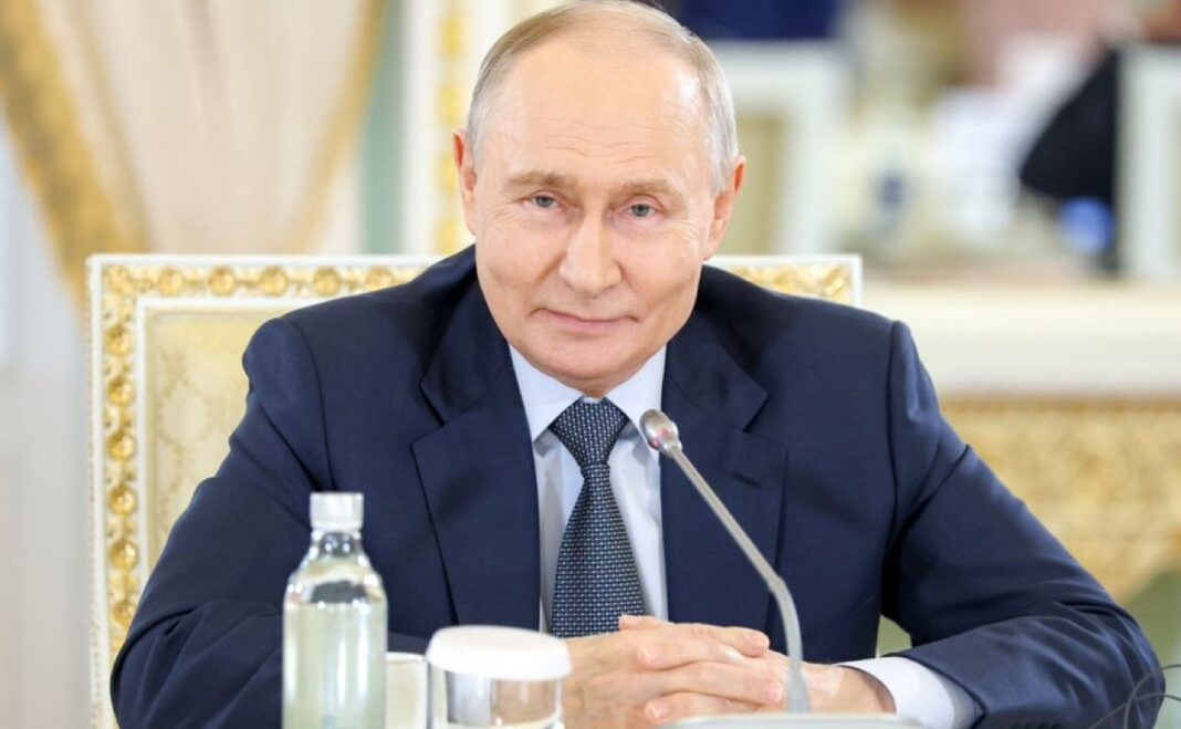 Vladimir Putin speaking at St. Petersburg news agency summit discussing Putin Anchorage compromise terms for ending the Ukraine war
