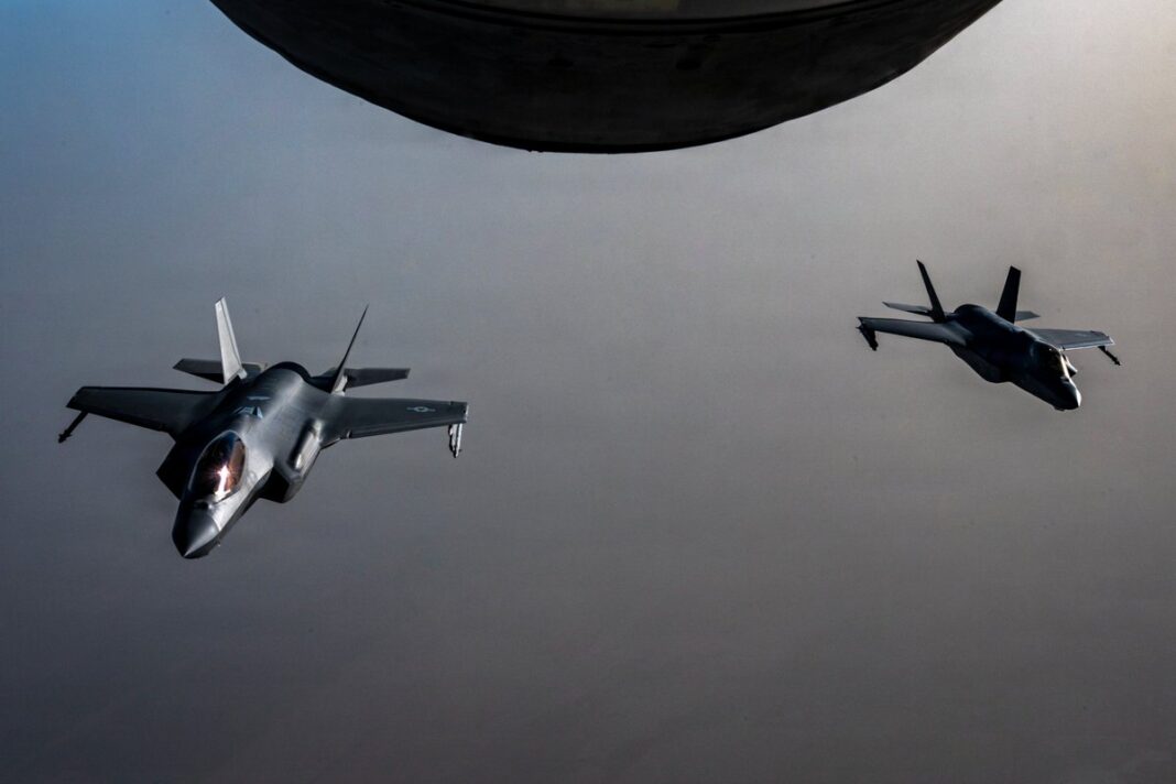 Two U.S. Air Force F-35A stealth fighter jets fly over the Middle East during a patrol ahead of U.S. strikes on Iranian air defense sites near the Strait of Hormuz