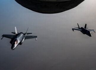 U.S. Strikes Iran After Apache Downing; Tehran Vows Response Two U.S. Air Force F-35A stealth fighter jets fly over the Middle East during a patrol ahead of U.S. strikes on Iranian air defense sites near the Strait of Hormuz
