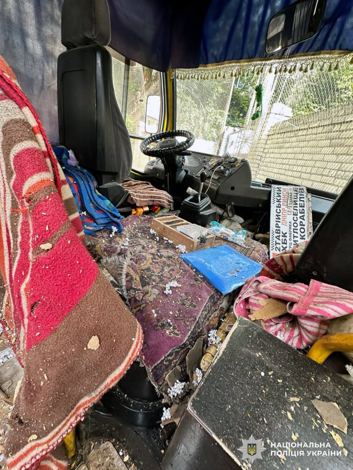 Damage from the reported drone strike on a Kherson minibus