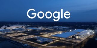 An aerial night view of a large illuminated Google data center complex with the word “Google” in large white letters across the top. (Screenshot)