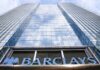 Barclays Cutting 5,000 Jobs in AI-Driven Cost Push A low-angle view looking up at the glass Barclays headquarters tower, with the blue Barclays sign at the bottom. (Screenshot)