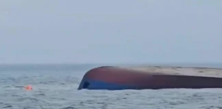 The overturned hull of a capsized ship floats in the Black Sea, with only the bottom of the vessel visible above the water. (Romanian Ministry For Internal Affairs via AP)