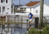 Coastal Flood Advisories Span Virginia and Maryland Shores A resident walks along a road covered by tidal floodwater on Tangier Island, Virginia, on Sept. 16, 2016. The file photo illustrates coastal flooding conditions in the Chesapeake Bay region.