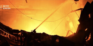 A firefighter sprays water on a burning, collapsed structure in the Kyiv region in footage shared by Ukrainian President Volodymyr Zelenskyy on X. (Photo: Zelenskyy via X)