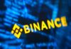 Binance Says $6.3B Hack May Involve Compromised Engineer Laptop Binance logo against computer code in an illustration accompanying Binance hack coverage.