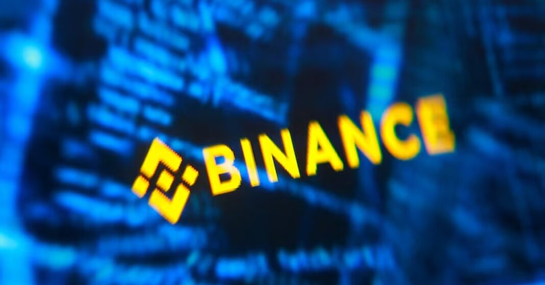 Binance logo against computer code in an illustration accompanying Binance hack coverage.