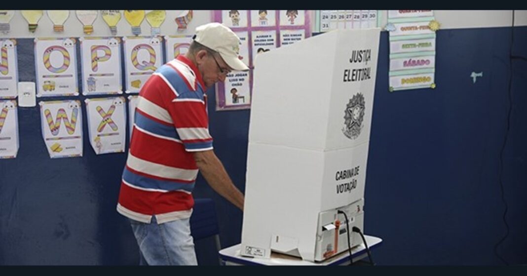 A voter uses an electronic voting machine during the Brazil presidential runoff.