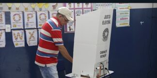 A voter uses an electronic voting machine during the Brazil presidential runoff.