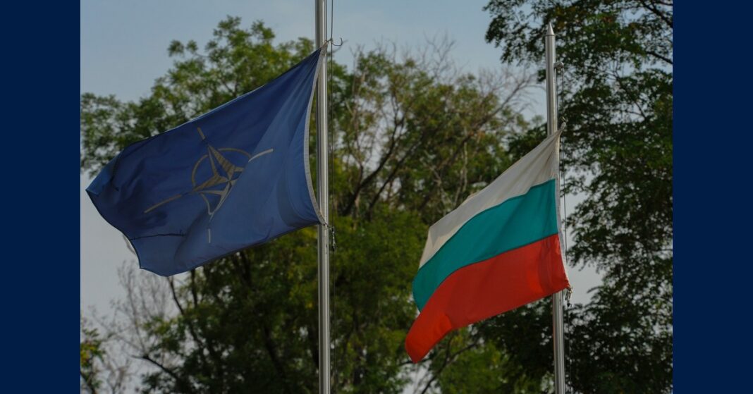 The NATO and Bulgarian flags fly side by side at Graf Ignatievo Air Base, Bulgaria, as the country prepares to join the Bulgaria NATO anti-drone initiative.