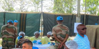 Health worker vaccinating a UN peacekeeper against Ebola in DR Congo (file photo)