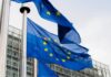 European Union flags waving outside an EU building