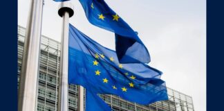 European Union flags waving outside an EU building