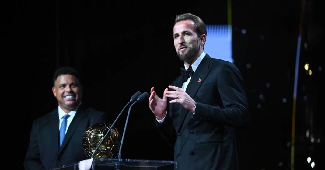 Harry Kane speaks at the podium with the Ballon d'Or trophy after winning the 2026 award, Harry Kane Ballon d'Or 2026
