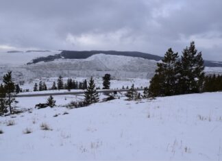 Teck Mine Runs at Reduced Capacity as Workers Strike Snow-covered Highland Valley Copper open-pit mine near Logan Lake, British Columbia