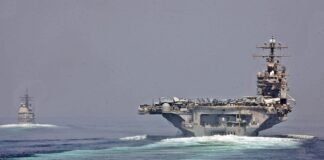 U.S. Navy ships transit the Strait of Hormuz