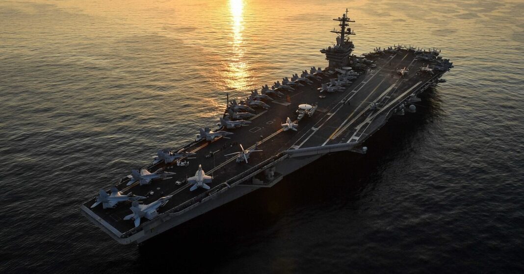 File photo of the aircraft carrier USS Theodore Roosevelt transiting the Arabian Gulf, US warns allies Iran strikes