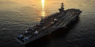 File photo of the aircraft carrier USS Theodore Roosevelt transiting the Arabian Gulf, US warns allies Iran strikes