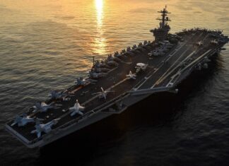 US Warns Allies to Prepare for Possible New Iran Strikes File photo of the aircraft carrier USS Theodore Roosevelt transiting the Arabian Gulf, US warns allies Iran strikes