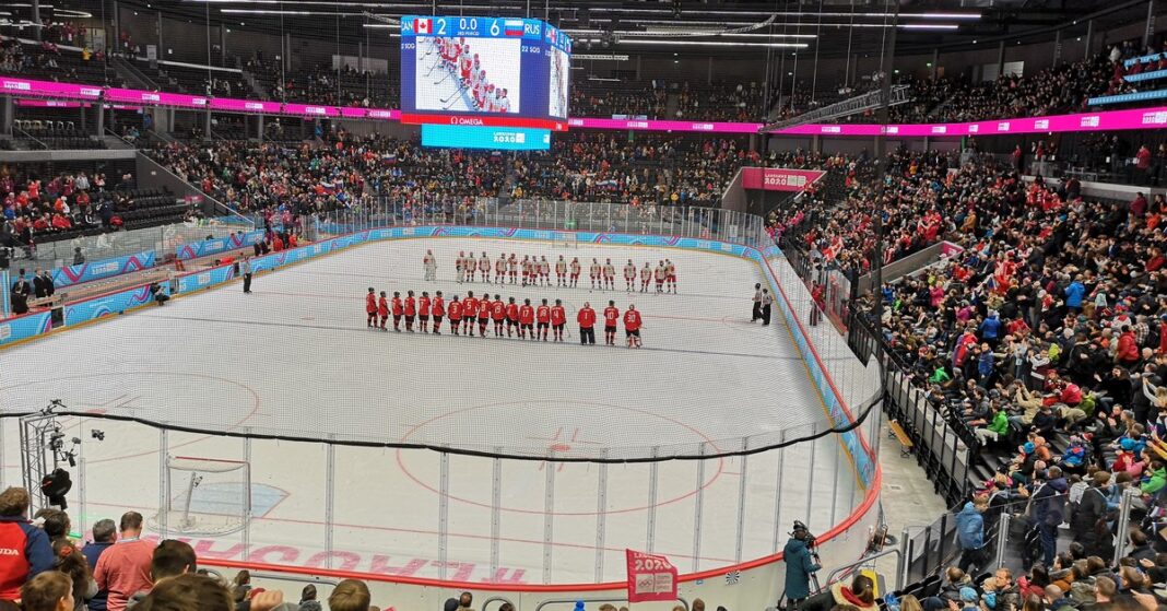 Canada and Russia junior players line up on the ice in a Russia return to international hockey file photo