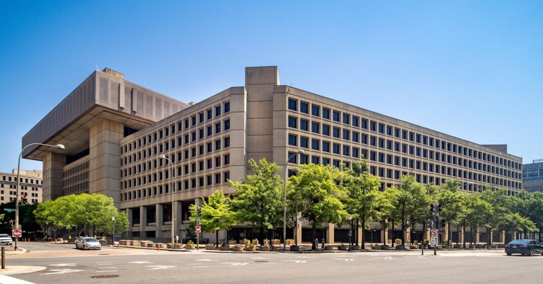 The J. Edgar Hoover Building, FBI headquarters in Washington, D.C. — prosecutors add obstruction count in case against ex-FBI officials.