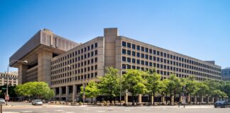 The J. Edgar Hoover Building, FBI headquarters in Washington, D.C. — prosecutors add obstruction count in case against ex-FBI officials.