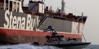 IRGC speedboat beside the tanker Stena Impero in the Strait of Hormuz — Iran Guards tanker mines claim