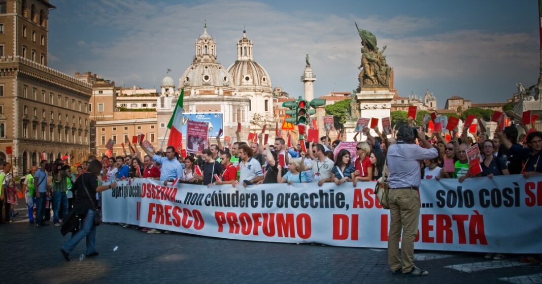 Protesters march through Rome during a demonstration — Italy general strike (file photo)
