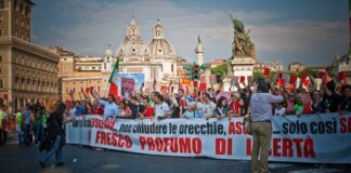 Protesters march through Rome during a demonstration — Italy general strike (file photo)