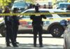 D.C. police officers behind crime-scene tape at the Jabrell Young shooting scene in the 200 block of 46th Street NE.