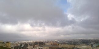 Cityscape of Khamis Mushait in Saudi Arabia's Asir region under cloudy skies