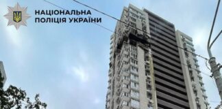 Damage near the upper floors of a Kyiv apartment building after a drone strike.
