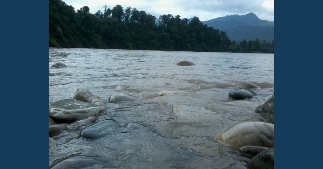 Trishuli River flowing around rocks in Nepal in a 2017 file photo accompanying a Nepal flood recovery report.