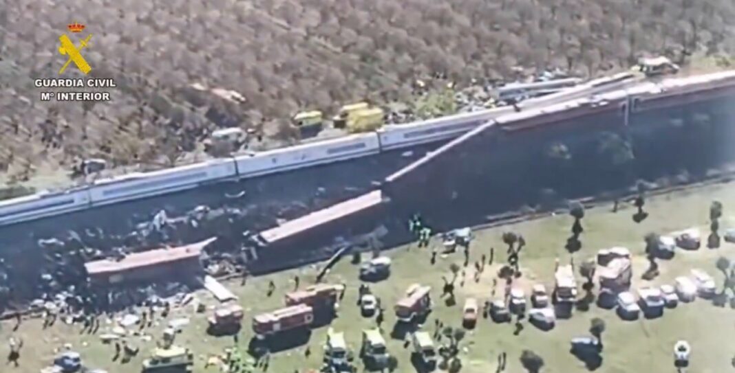 Aerial view of the train collision in Toledo province, Spain, showing derailed cars and emergency vehicles at the scene