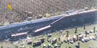 Aerial view of the train collision in Toledo province, Spain, showing derailed cars and emergency vehicles at the scene