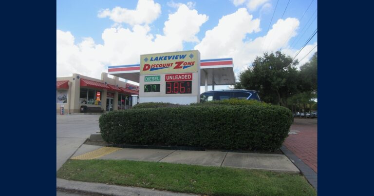 Gas station price sign in New Orleans showing unleaded gasoline at $3.86 a gallon