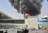 Riyadh Airport Attack Killed 12, Injured 309, Saudi Officials Say Thick black smoke and flames rise behind a terminal building at King Khalid International Airport in Riyadh, Saudi Arabia, as a passenger jet sits parked nearby