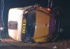25 Taken to Hospitals After Salem High Football Bus Overturns Salem High School bus crash scene showing a yellow school bus lying on its side at night.