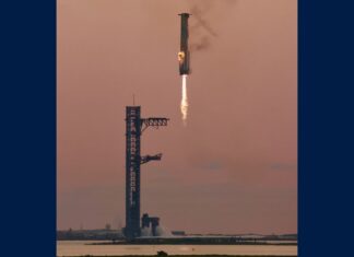 A SpaceX Starship booster approaches the launch tower during the IFT-5 flight test, in a file photo