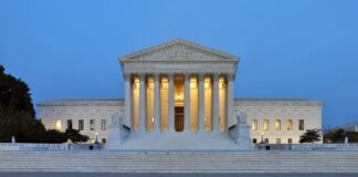 The U.S. Supreme Court building at dusk