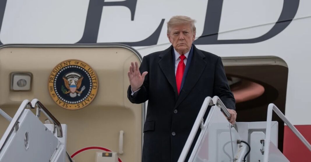 President Donald Trump waves as he boards Air Force One
