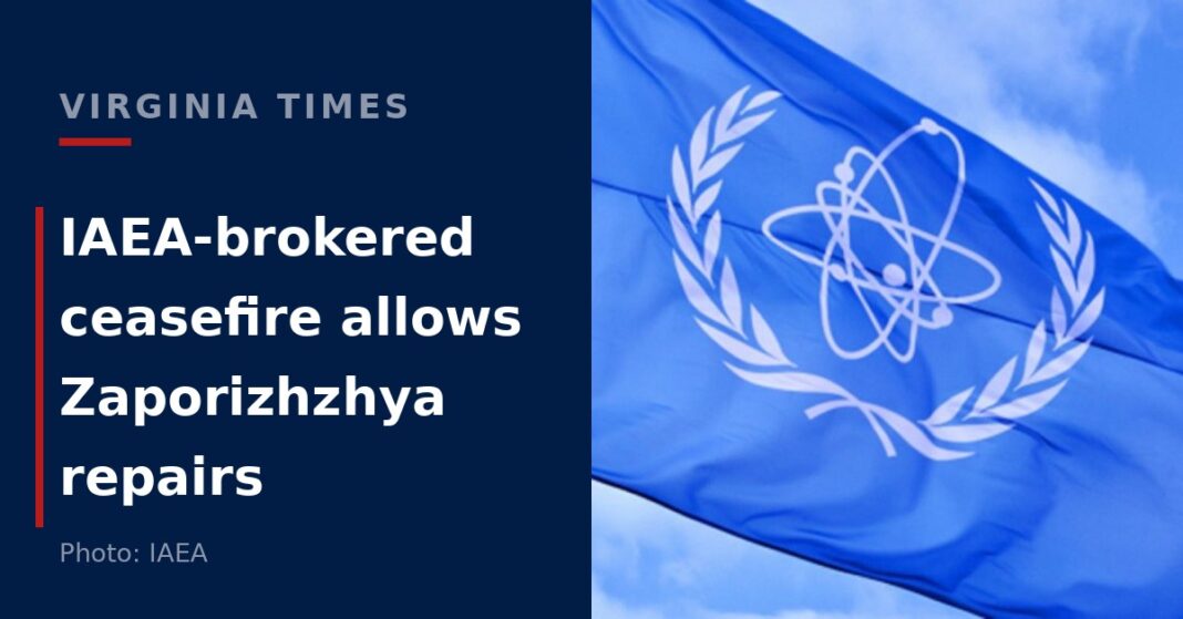 The flag of the International Atomic Energy Agency flying against a blue sky during the Zaporizhzhya nuclear plant ceasefire in Ukraine.