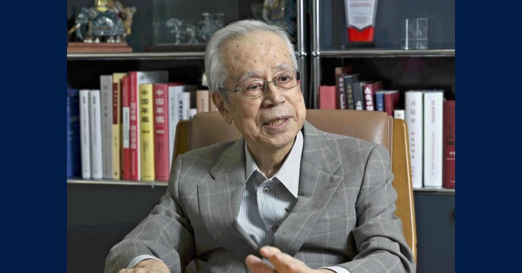 Yasuo Fukuda dies at 90; the former Japanese prime minister is pictured seated in front of bookshelves.