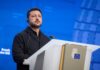 Zelenskyy Says Putin Does Not Want Negotiations ‘in Any Format’ Ukrainian President Volodymyr Zelenskyy at a lectern with an EU emblem, accompanying coverage of Zelenskyy on Putin and negotiations.