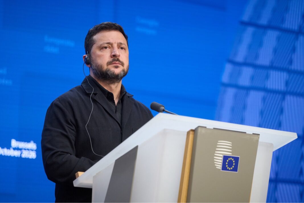 Ukrainian President Volodymyr Zelenskyy at a lectern with an EU emblem, accompanying coverage of Zelenskyy on Putin and negotiations.