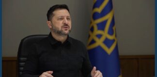 Zelenskyy trilateral talks: Ukrainian President Volodymyr Zelenskyy speaks beside a blue and gold flag during a Hudson Institute address
